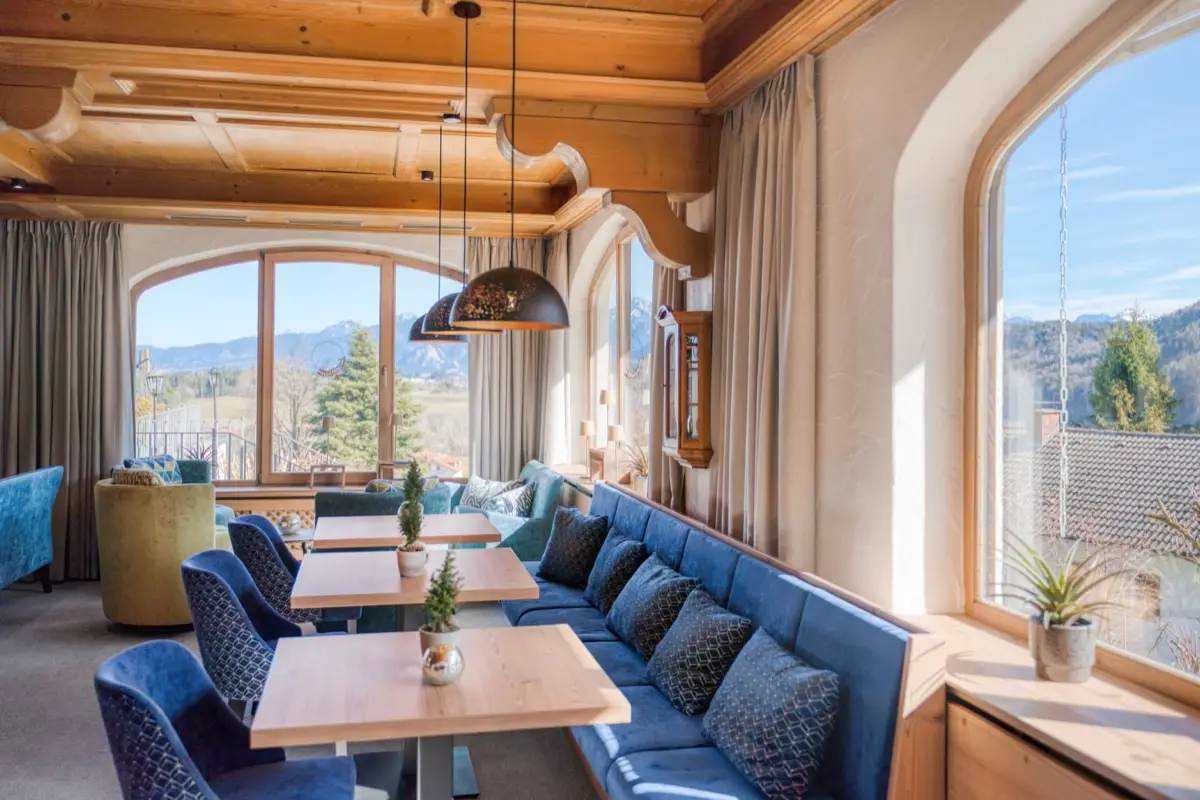 Lounge with arched windows and a view of the mountains